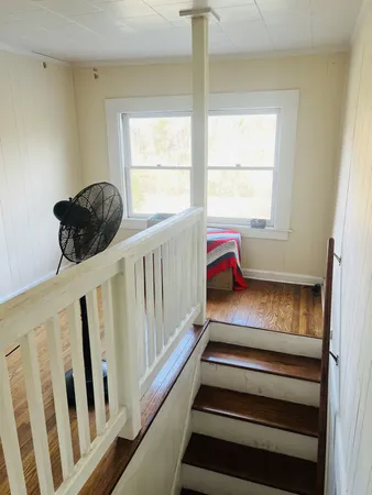 a view of entryway with wooden floor