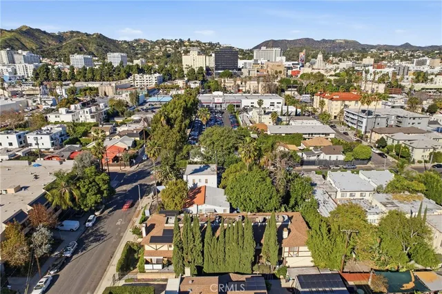 an aerial view of residential houses with outdoor space