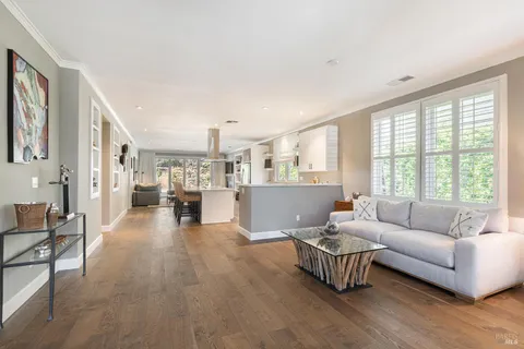 a kitchen with a sink a stove and cabinets