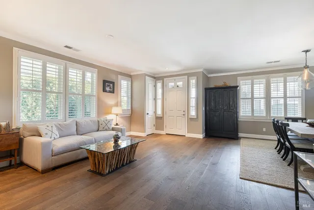 a view of a bedroom with a bed and a window