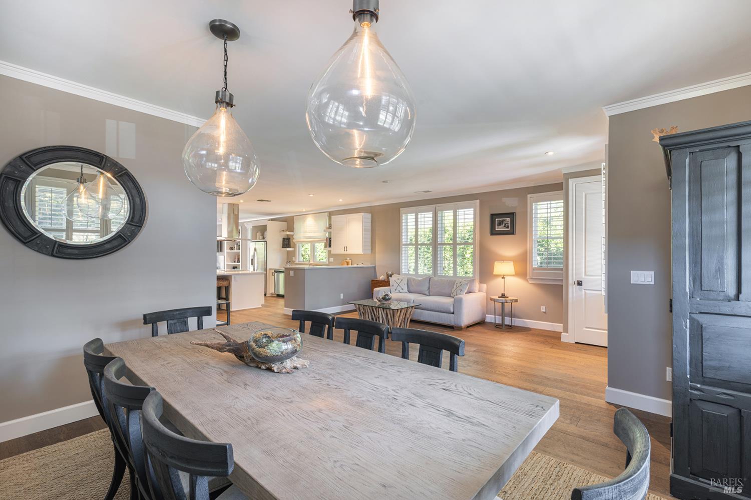 1982 Adams Street Yountville, CA 94599 - Photo 19 of 69 a view of a dining room with furniture a chandelier and wooden floor
