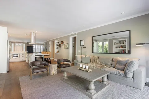 a bathroom with a granite countertop sink toilet a mirror and shower