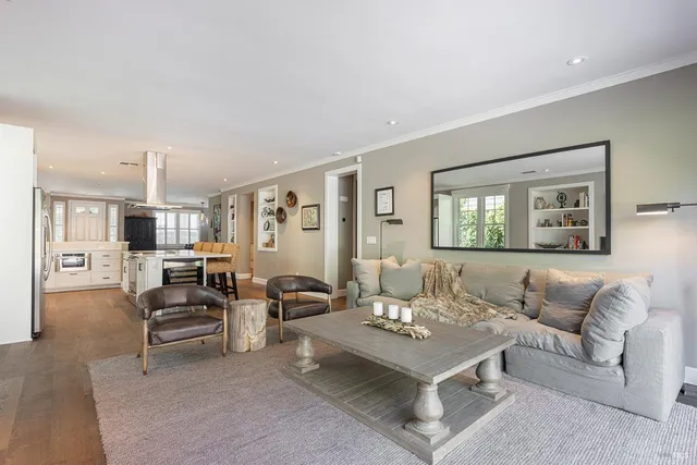 a bathroom with a granite countertop sink toilet a mirror and shower