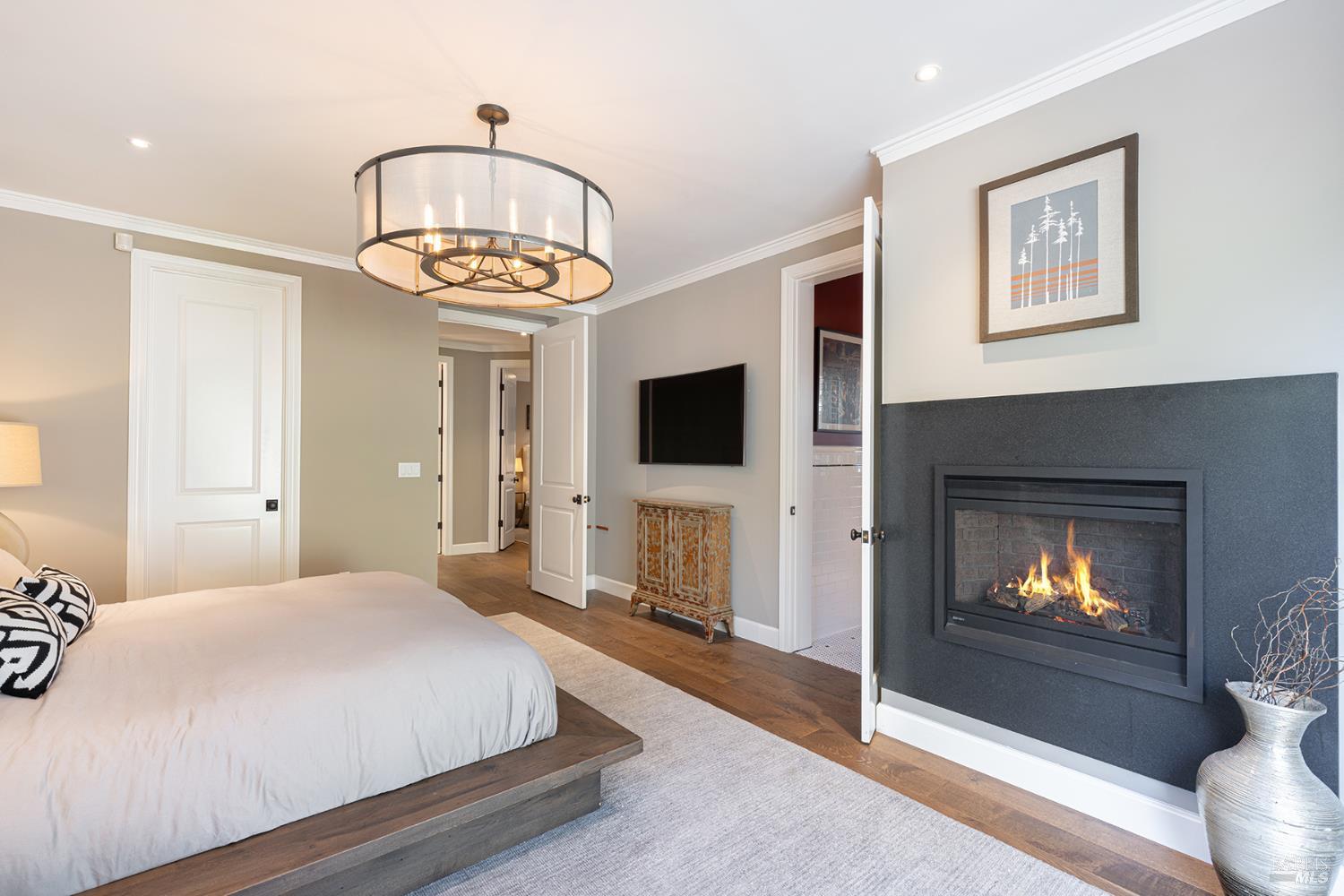 1982 Adams Street Yountville, CA 94599 - Photo 27 of 69 a bedroom with a bed and a fireplace