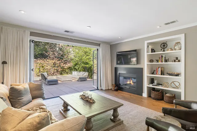 a large white kitchen with a large window