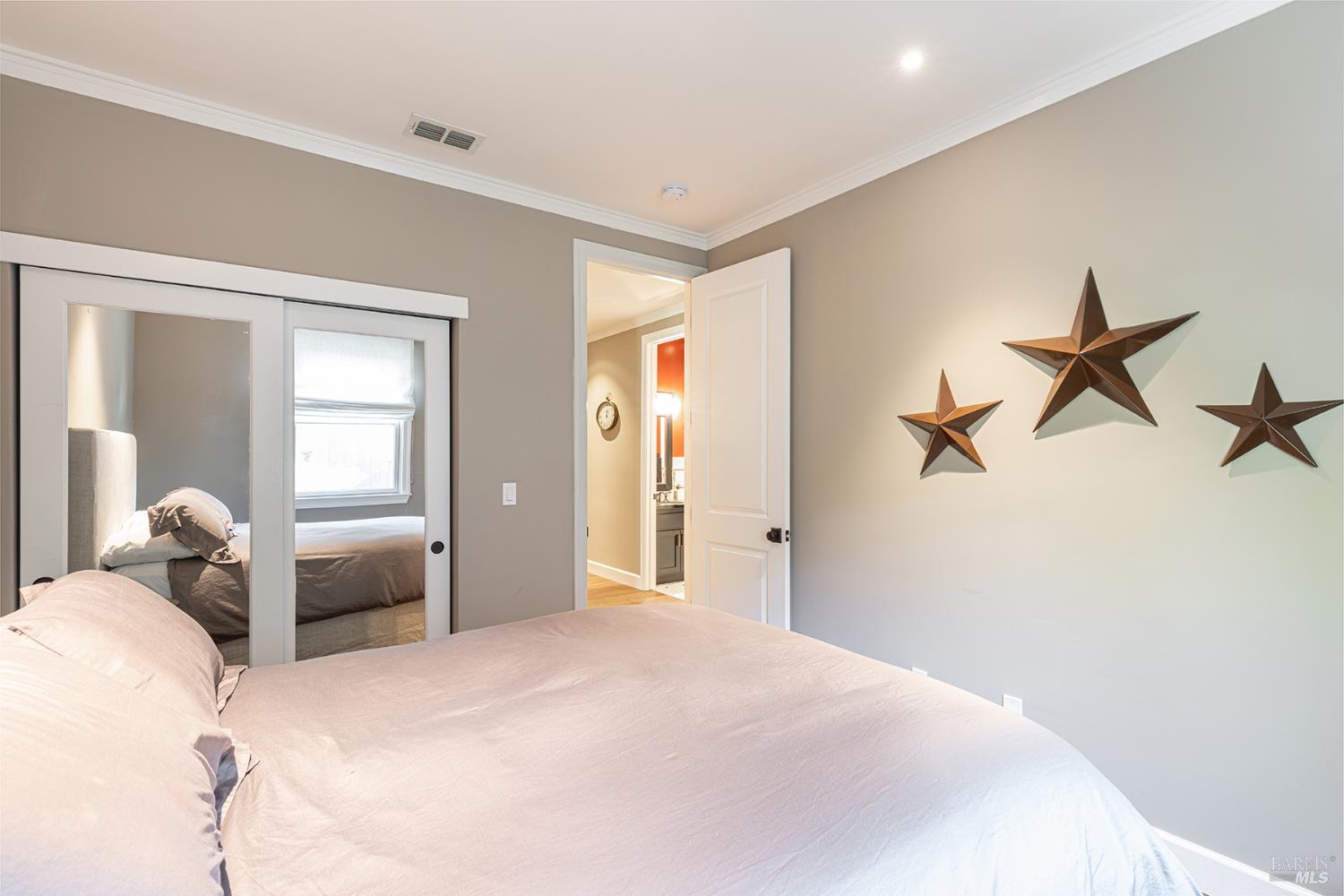 1982 Adams Street Yountville, CA 94599 - Photo 36 of 69 a bedroom with a bed and a chandelier