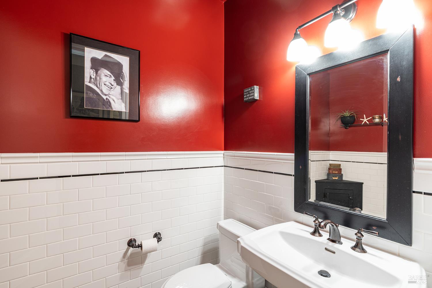 1982 Adams Street Yountville, CA 94599 - Photo 37 of 69 a bathroom with a toilet sink and mirror