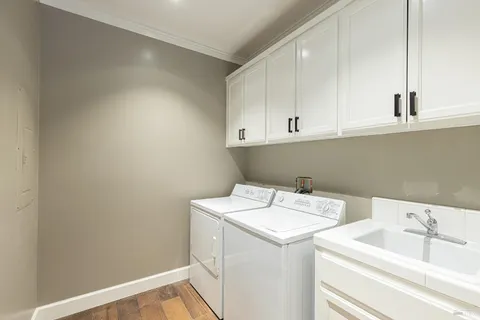 a view of a house with potted plants