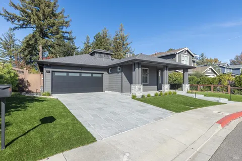 a view of a dining room with furniture a chandelier and wooden floor