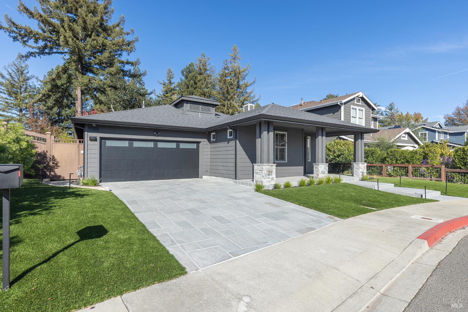 1982 Adams Street Yountville, CA 94599 - Photo 10 of 69 a front view of a house with a yard and garage