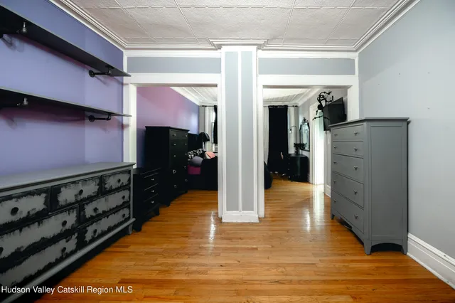 a view of hallway with wooden floor