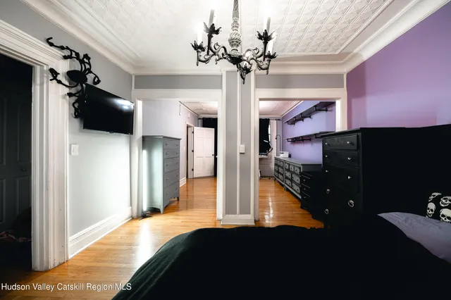 a living room with furniture and a bookshelf