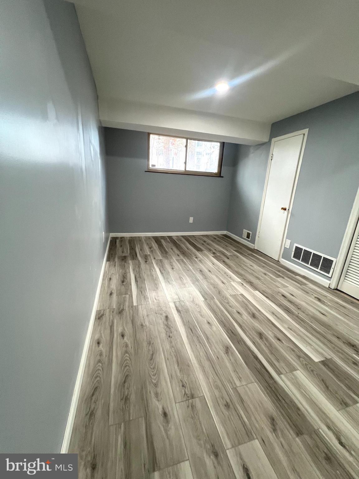 11823 Falls Road Potomac, MD 20854 - Photo 12 of 20 a view of an empty room and window