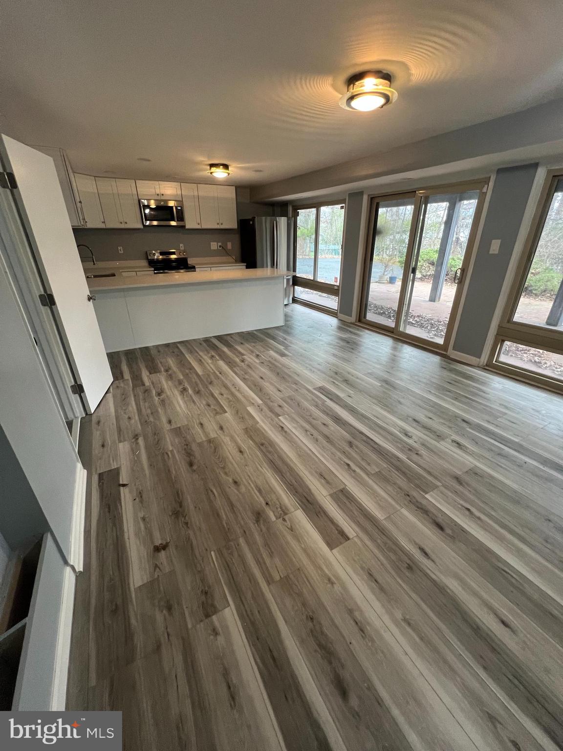 11823 Falls Road Potomac, MD 20854 - Photo 18 of 20 wooden floor in an empty room with a window