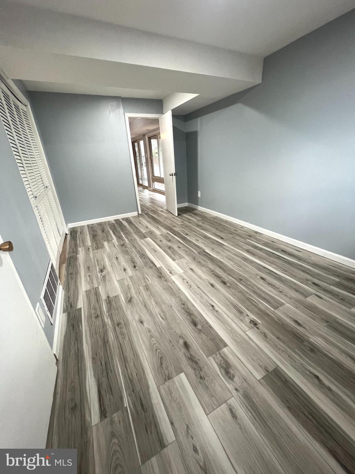 11823 Falls Road Potomac, MD 20854 - Photo 10 of 20 a view of empty room with wooden floor