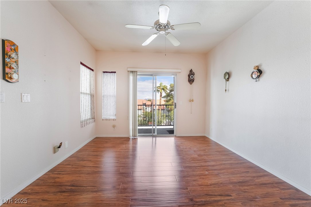 2201 Ramsgate Drive, Unit 823 Henderson, NV 89074 - Photo 15 of 31 Unfurnished room with baseboards, ceiling fan, and wood finished floors