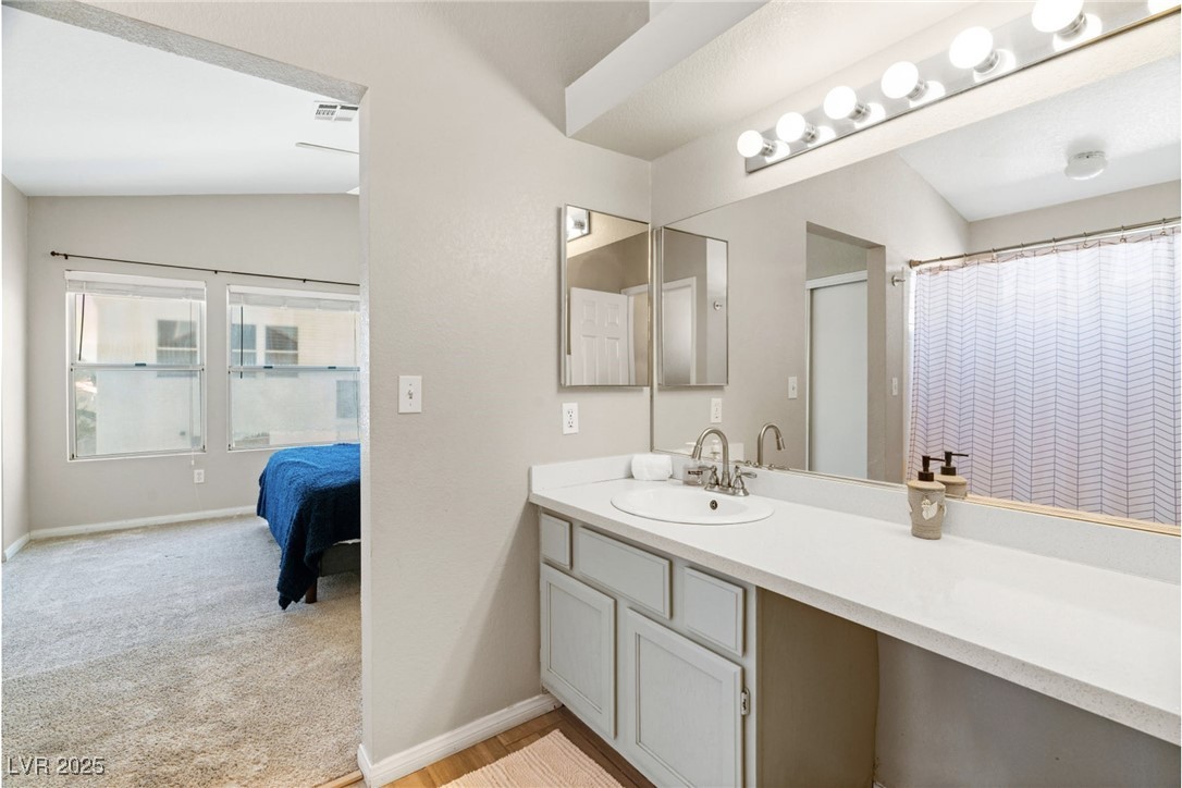 8213 Grassy Point Circle Las Vegas, NV 89145 - Photo 17 of 31 Full bathroom with visible vents, baseboards, and vanity