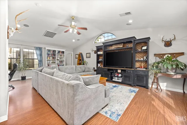a view of a dining room with furniture and window