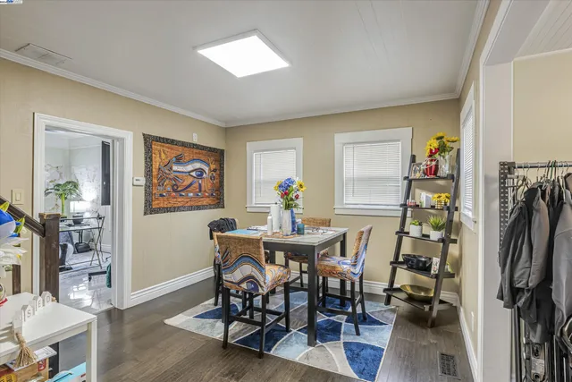 a view of a dining room with furniture wooden floor and a rug