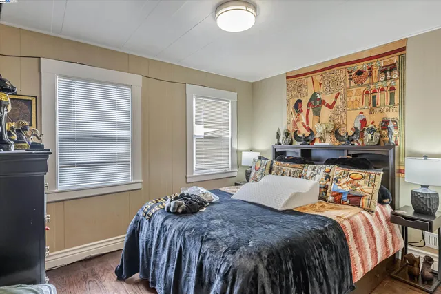 a bedroom with a bed and window