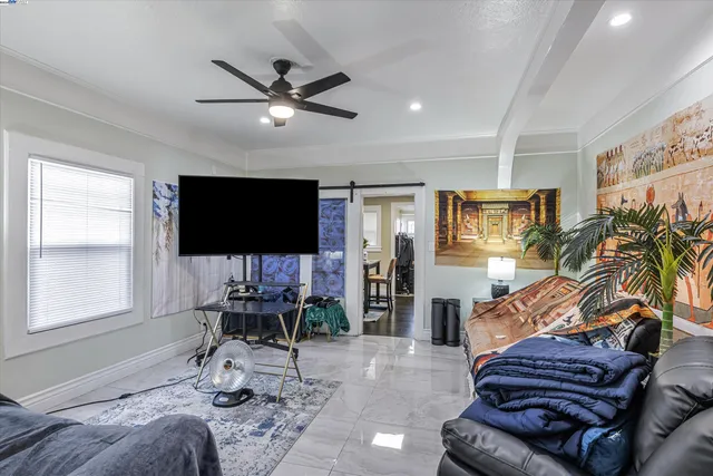 a living room with furniture and a flat screen tv