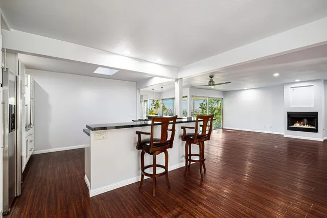 a kitchen with a stove and white cabinets