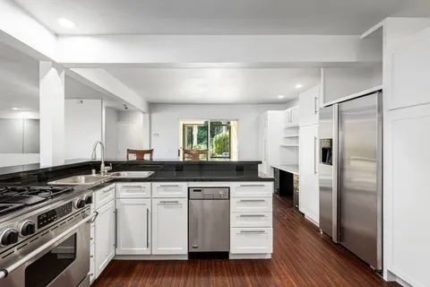a view of a balcony with chairs