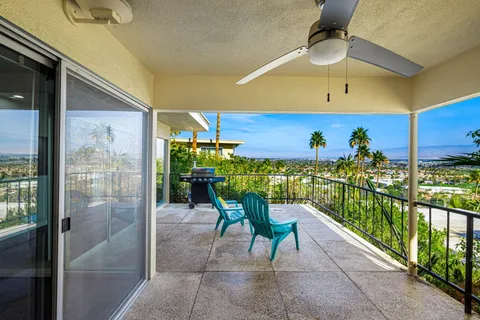 a view of a house with a garden and swimming pool