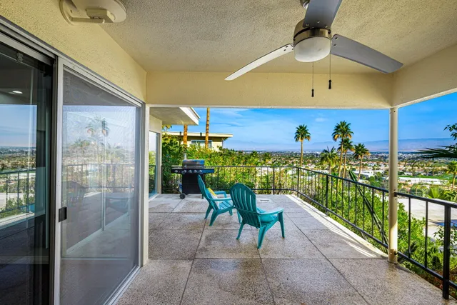 a view of a house with a garden and swimming pool