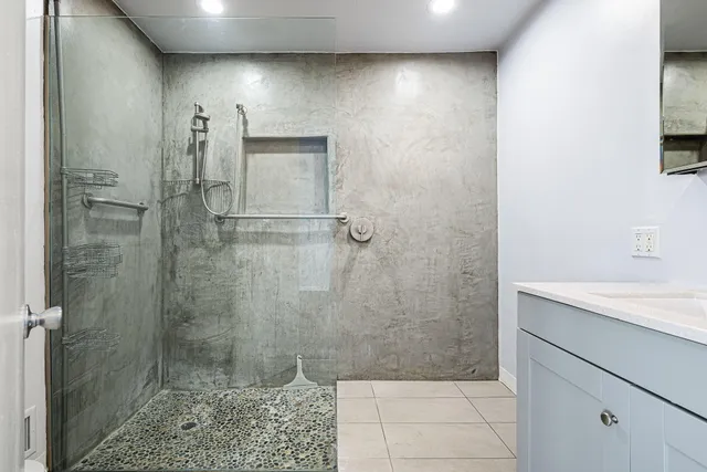 a view of empty room with wooden floor and fireplace