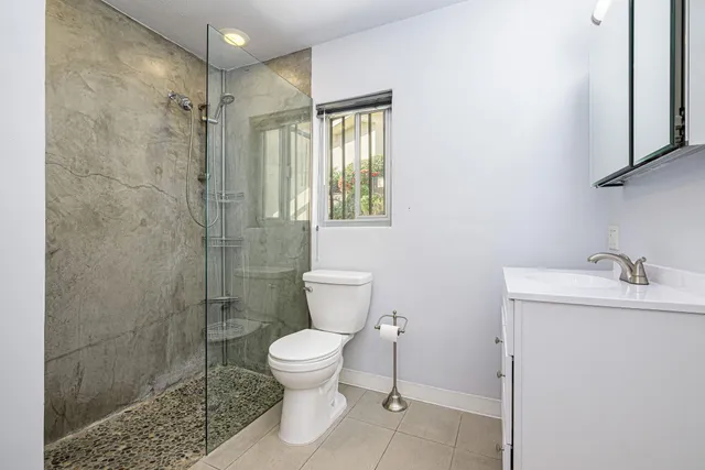 a view of a swimming pool with a deck and a garden