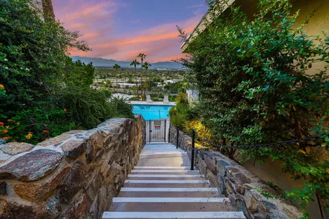 a view of a swimming pool with a patio