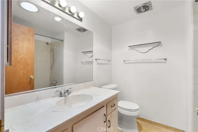 a bathroom with a shower and a bath tub