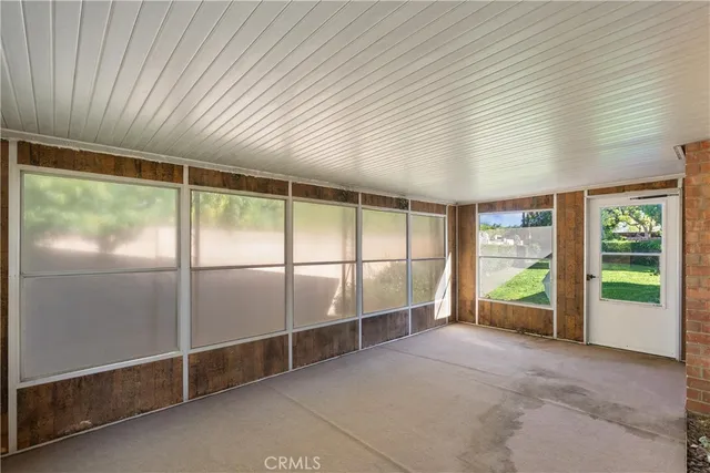 a view of a backyard with plants and a patio