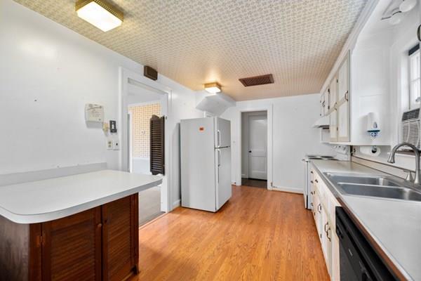347 Weston Road Wellesley, MA 02481 - Photo 8 of 17 a kitchen with a sink appliances and cabinets