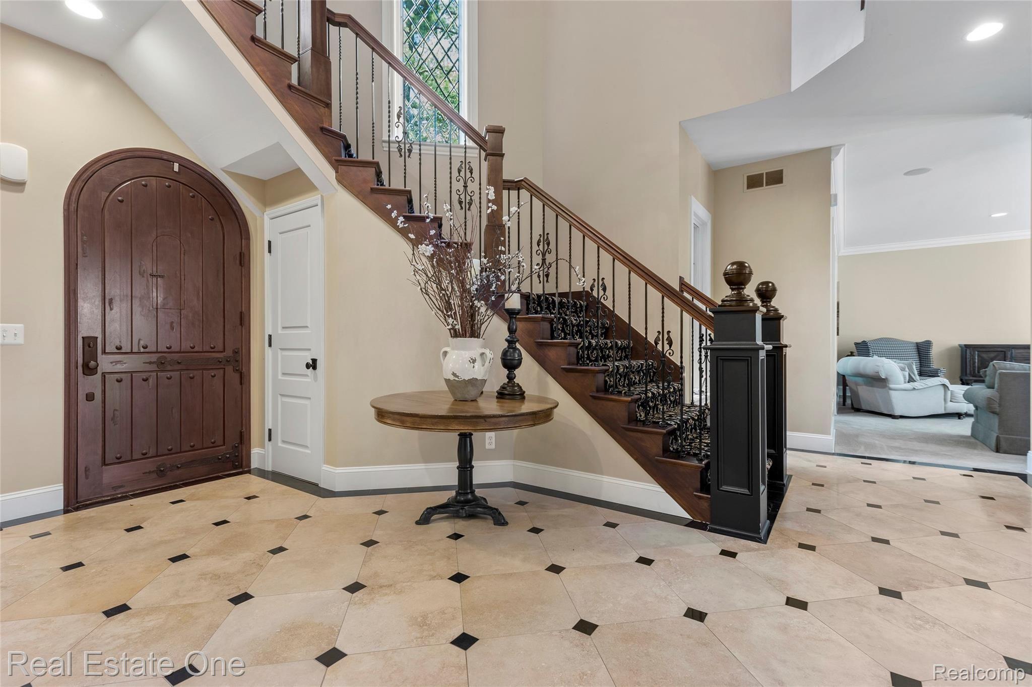 7807 Fieldstone Ridge Clarkston, MI 48348 - Photo 12 of 59 Gleaming Travertine floor Foyer with grand staircase.