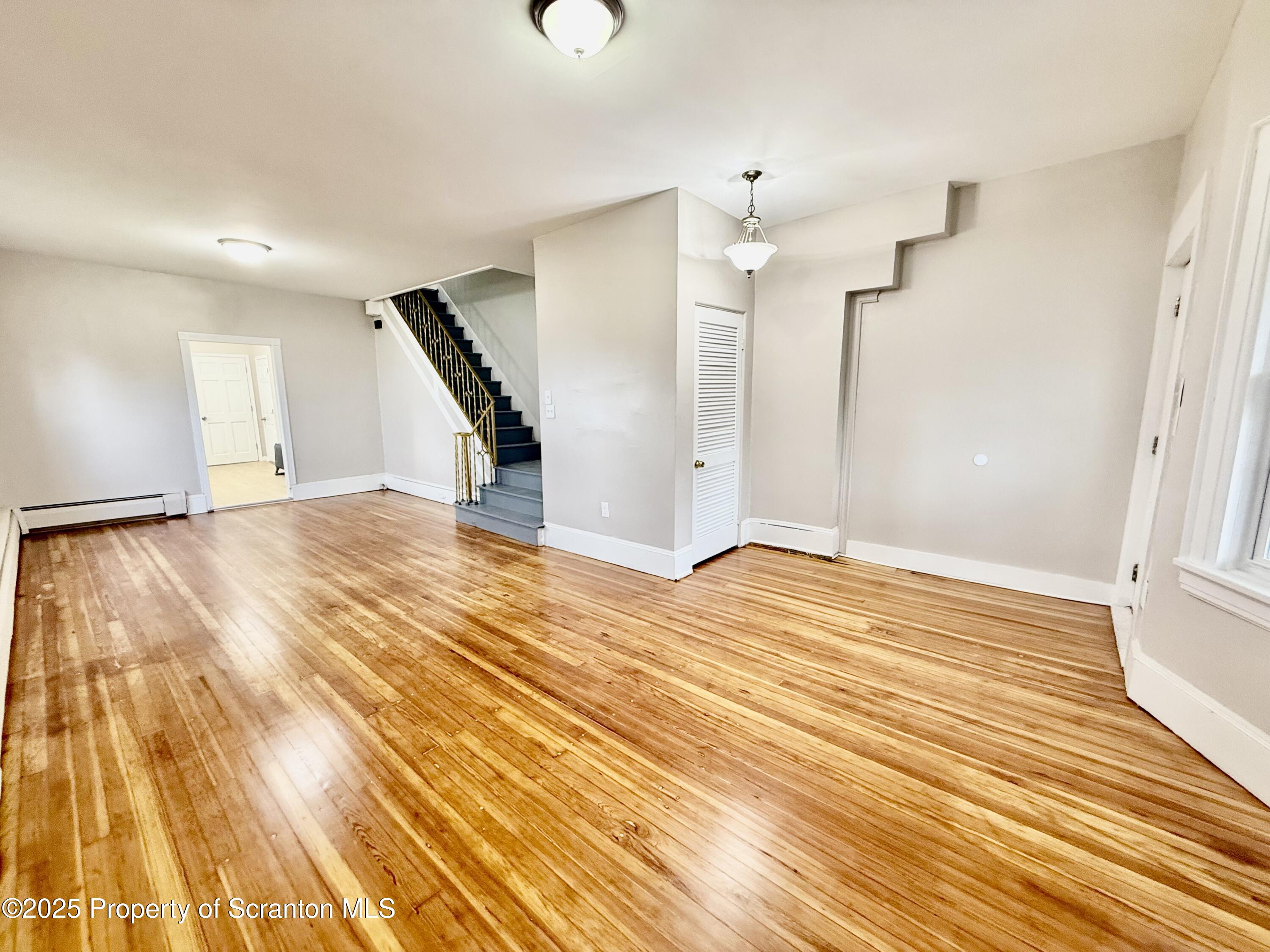 611 Harrison Avenue Scranton, PA 18510 - Photo 3 of 18 a view of empty room with wooden floor