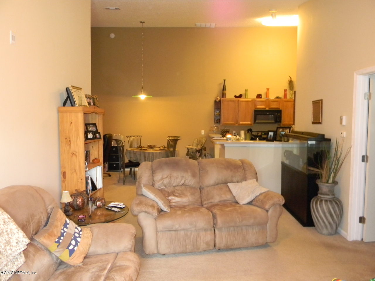 7920 Merrill Road, Unit 714 Jacksonville, FL 32277 - Photo 3 of 12 a view of a livingroom with furniture and a floor to ceiling window
