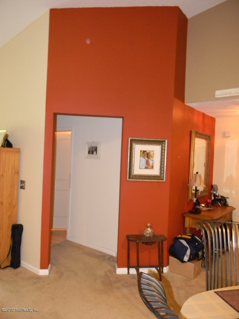 7920 Merrill Road, Unit 714 Jacksonville, FL 32277 - Photo 4 of 12 a view of a livingroom with furniture and toys