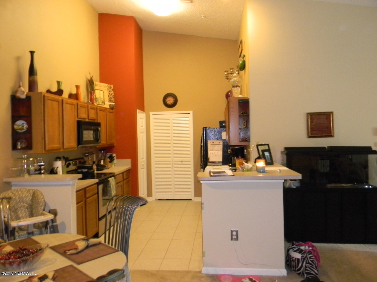 7920 Merrill Road, Unit 714 Jacksonville, FL 32277 - Photo 5 of 12 a view of a kitchen with appliances and cabinets