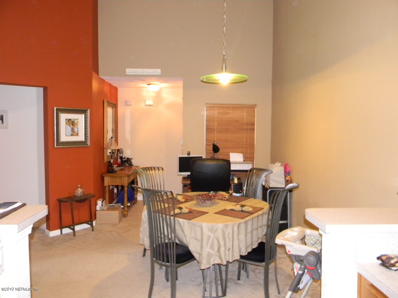 7920 Merrill Road, Unit 714 Jacksonville, FL 32277 - Photo 6 of 12 a view of a dining room with furniture and chandelier