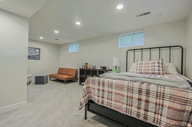 2924 Robidoux Road Sandy, UT 84093 - Photo 46 of 68 Recessed lighting, light gray carpet, and two windows with blinds