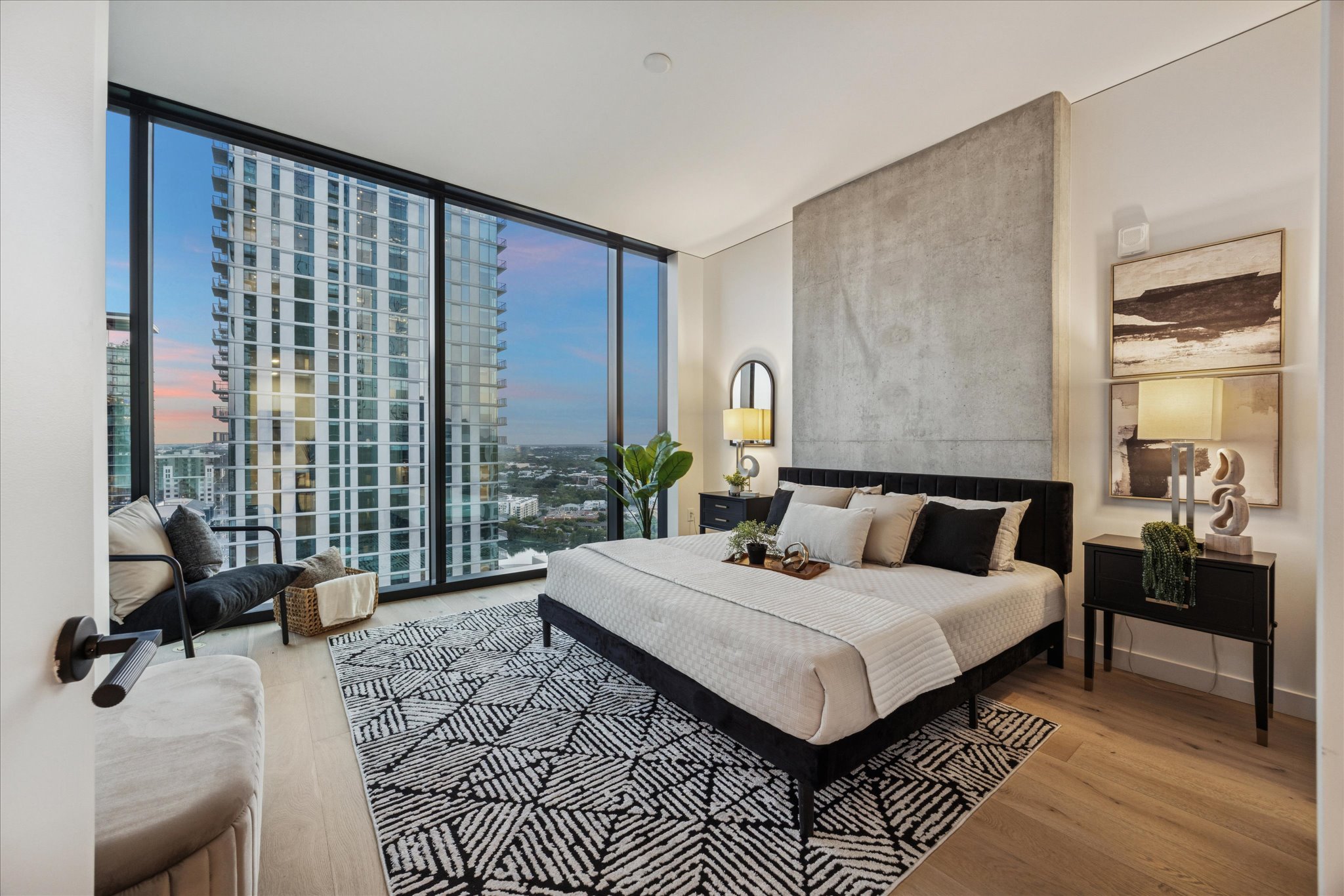 610 Davis Street, Unit 3102 Austin, TX 78701 - Photo 11 of 40 a bed room with a bed and a couch