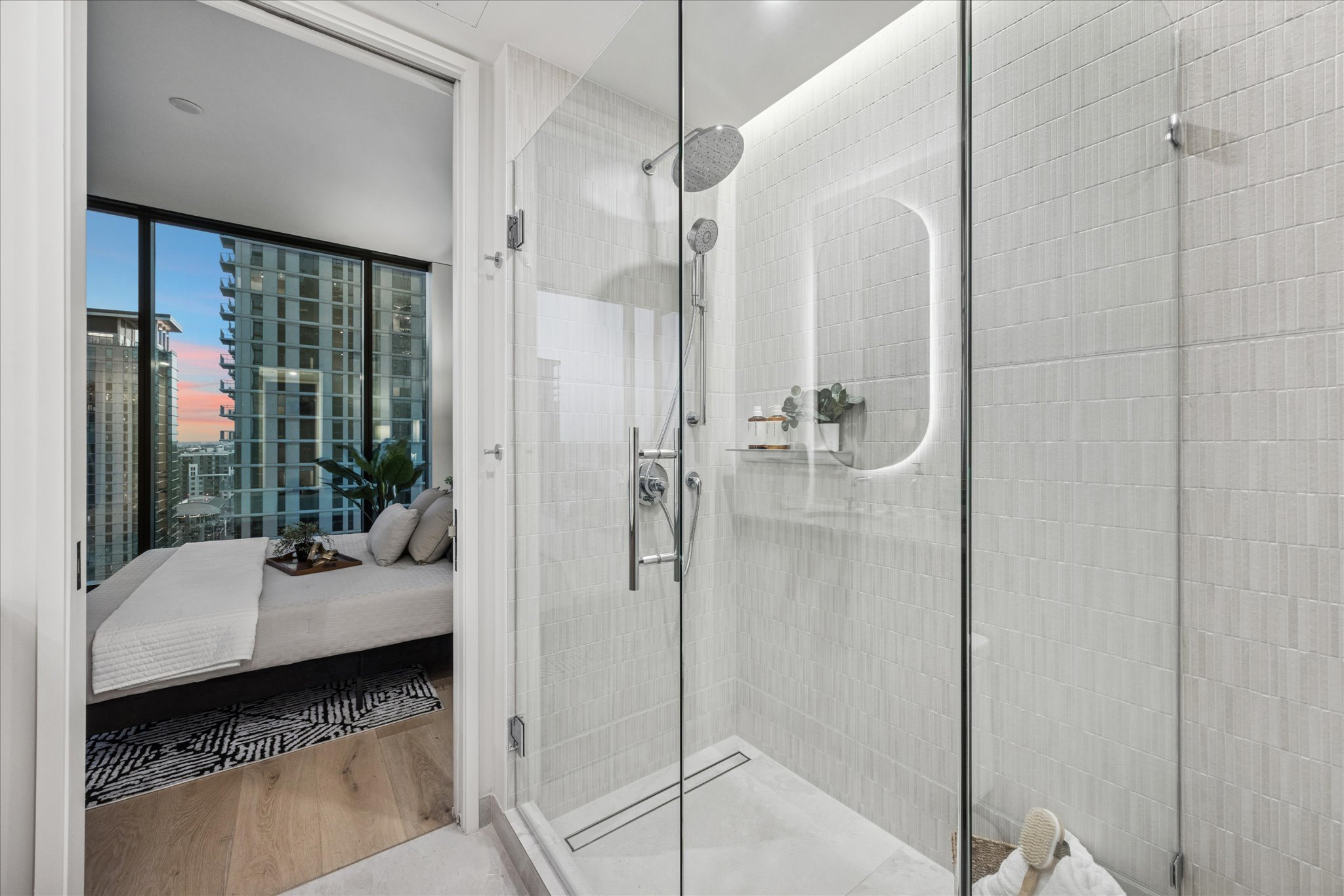 610 Davis Street, Unit 3102 Austin, TX 78701 - Photo 16 of 40 a bathroom with a tub shower and sink