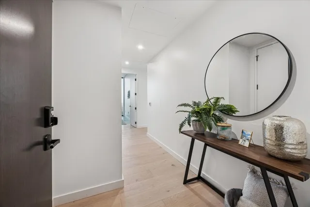 a kitchen with stainless steel appliances a sink a stove and cabinets