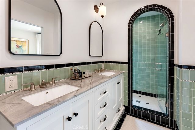 a bathroom with mirror and