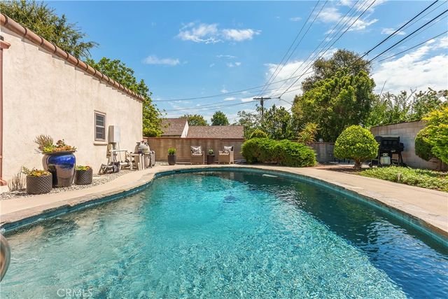 a view of a backyard with sitting area
