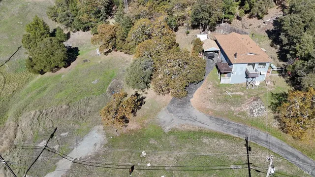a view of an chairs and table in the patio