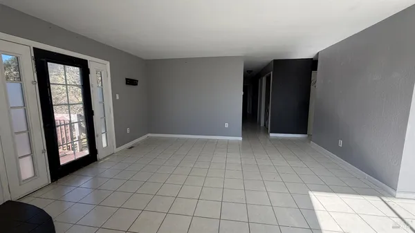 a view of a balcony with wooden fence and floor
