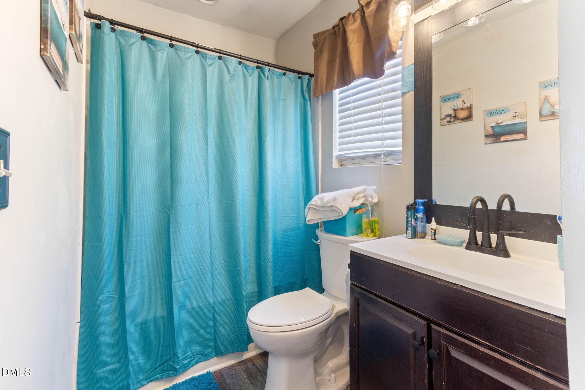 3713 Marshlane Way Raleigh, NC 27610 - Photo 27 of 38 a bathroom with a sink a toilet and shower
